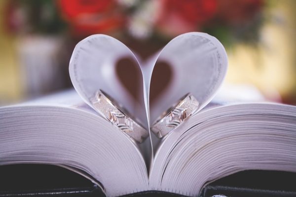 wedding rings inside a book