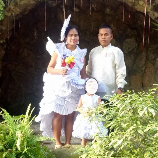 bride wears wedding gown made from paper